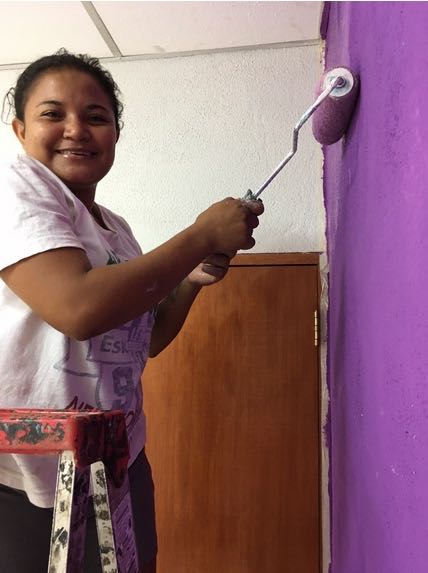 Rosita helping to paint the new sponsorship office.